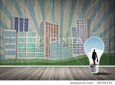 Businesswoman trapped in bulb Businesswoman trapped in bulb 98936143