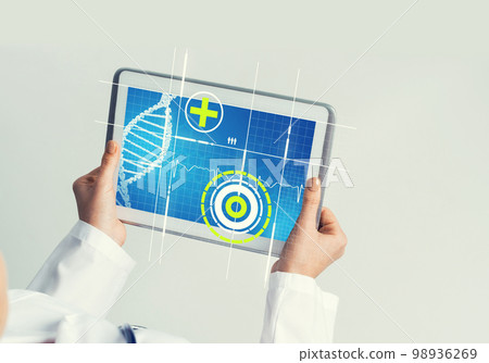 Close of female doctor hands working with tablet pc computer Close of female doctor hands working with tablet pc computer 98936269