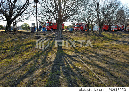 Firefighters gather in the park for the New Year's parade 98938650