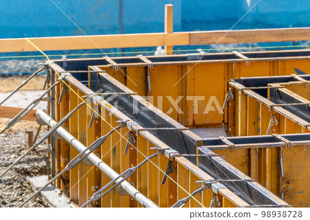 Construction site, foundation work, reinforcement work, metal form, steel formwork Construction site, foundation work, reinforcement work, metal form, steel formwork 98938728
