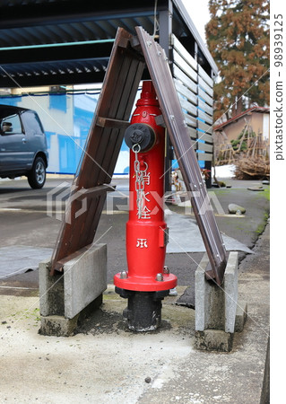 Niigata Minamiuonuma fire hydrant surrounded by snow 98939125