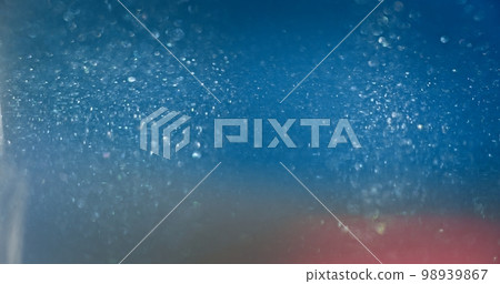 Bokeh light overlay. Blur glitter texture. Shiny bubbles. Defocused neon blue pink color gradient lens flare glow abstract background with free space. 98939867
