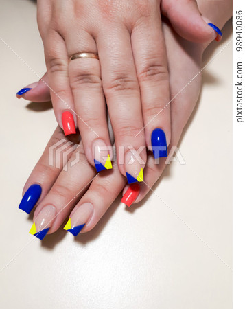 Acrylic nail extension, manicure, nail correction, hands in the foreground. Reflective design. 98940086