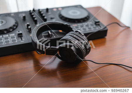 Close-up  dj controller and Sound mixing desk at home 98940267