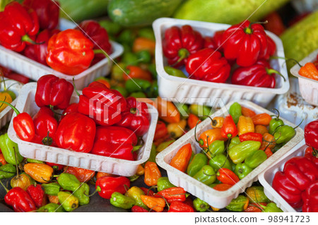 Stack of Piment cabri on a market stall 98941723