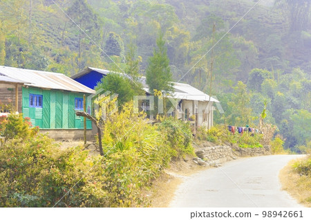 A beautiful wooden hill side cottage on mountain background.Rangbang river mountain valley.Tabakoshi West Bengal IndiaDecember 31, 2022 A beautiful wooden hill side cottage on mountain background.Rangbang river mountain valley.Tabakoshi West Bengal IndiaDecember 31, 2022 98942661