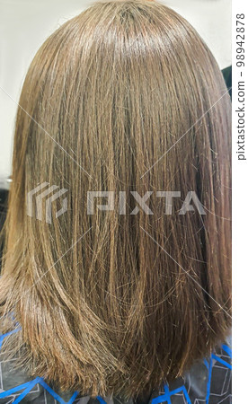 Hair coloring and cutting. Hairstyling in a beauty salon. Hair close-up. 98942878