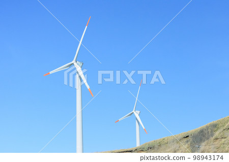 wind turbines on a hill 98943174