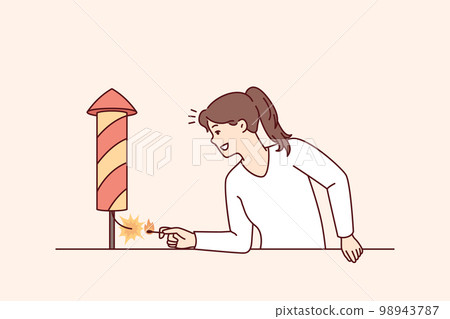 Positive woman with smile sets fire to firecracker wanting to start festive firework 98943787