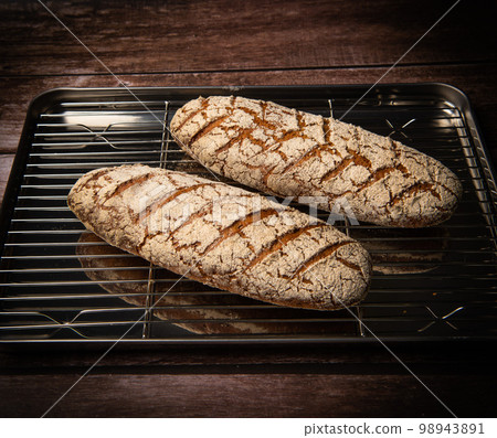 Rye bread on brown background 98943891