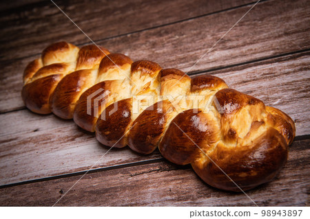 Homemade traditional greek braided brioche Homemade traditional greek braided brioche 98943897