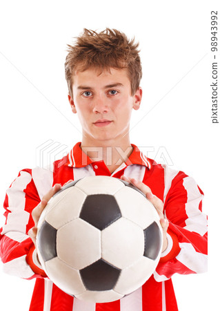 Soccer player holding a ball Soccer player holding a ball 98943992