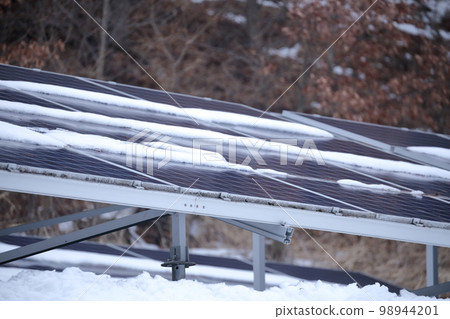 snow covered solar panel 98944201