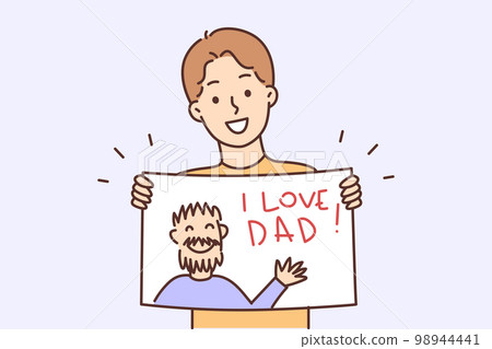 Happy teenager boy holding poster with inscription I love dad and image of man in hands 98944441