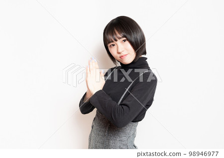 young woman asking young woman asking 98946977