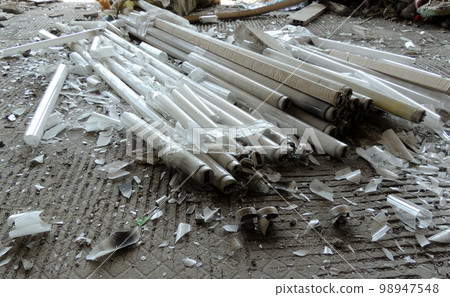 Glass Debris Of Crushed Tube Lamps On Dirty Cement Floor Glass Debris Of Crushed Tube Lamps On Dirty Cement Floor 98947548