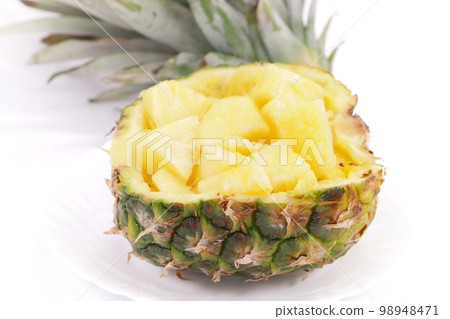 Pineapple boat dessert bright background Pineapple boat dessert bright background 98948471