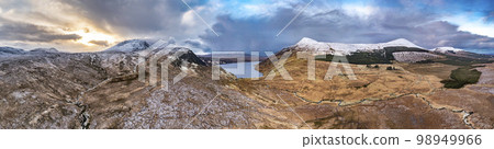 Aerial view of the snow covered Mount Errigal, the highest mountain in Donegal - Ireland. 98949966