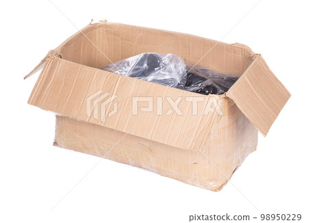 Battered cartboard box isolated on white Battered cartboard box isolated on white 98950229