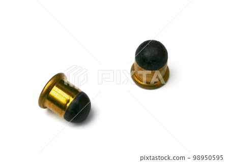 Two .22 BB caps on white background 98950595
