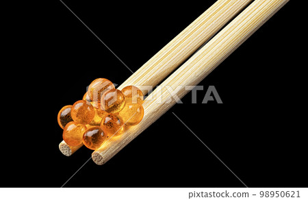 Red caviar on chopsticks for sushi isolated on black background Red caviar on chopsticks for sushi isolated on black background 98950621