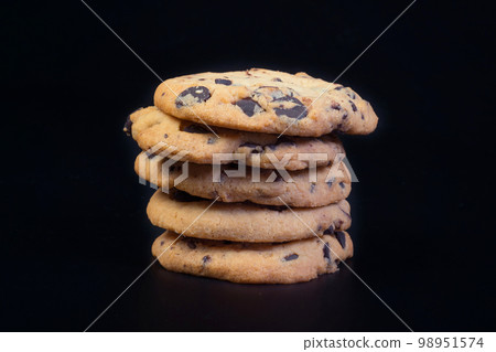 A close-up of cookies at the black background. 98951574