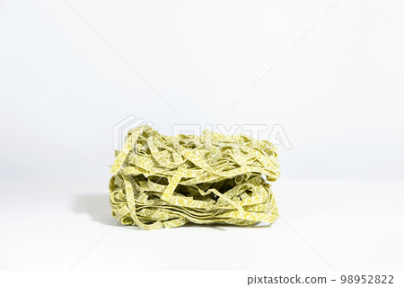 Tagliatelle dry green pasta , cooking spaghetti homemade italian cuisine. Tagliatelle dry green pasta , cooking spaghetti homemade italian cuisine. 98952822