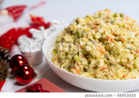 Olivier Russian salad on a Christmas and New Year background, top view. 98953038