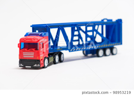 Toy car transporter with cars on a white background with place for text, copy space, for a toy store. 98953219