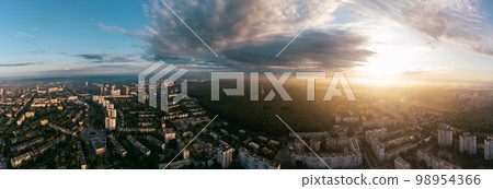 Wide aerial sunrise cloudscape panorama above city 98954366