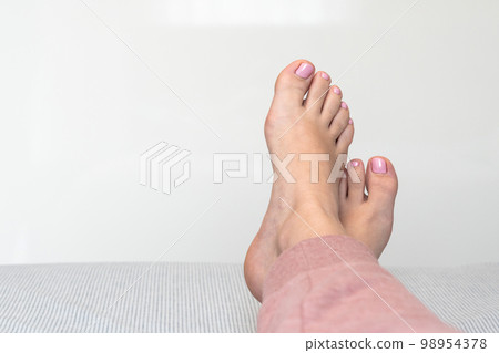 Closeup of female feet and toes on white background. Healthy feet concept Closeup of female feet and toes on white background. Healthy feet concept 98954378