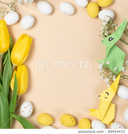 Happy Easter - layout with space for text center, Easter bunnies made of origami paper and eggs, top view 98954433