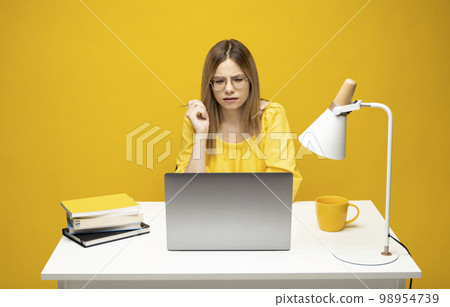 Stressed angry business woman having problem with laptop. Frustrated woman fed up with bad news online or virus from internet, critical fatal error, all data loss. Stressed angry business woman having problem with laptop. Frustrated woman fed up with bad news online or virus from internet, critical fatal error, all data loss. 98954739