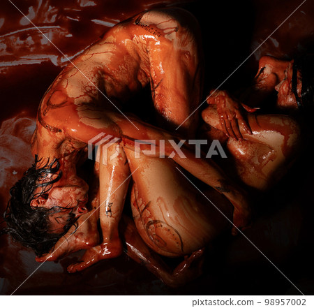 Bloodstained naked couple on the floor view Bloodstained naked couple on the floor view 98957002