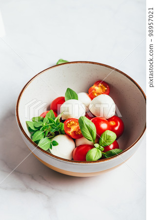 Freshly made italian salad caprese Freshly made italian salad caprese 98957021
