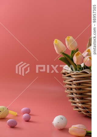 Basket with tulips and eggs 98957305