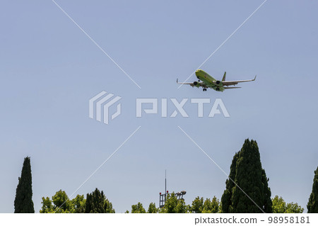 Passenger plane in the green coloring of the company S7 against the blue sky. Russia Sochi July 2022. Passenger plane in the green coloring of the company S7 against the blue sky. Russia Sochi July 2022. 98958181