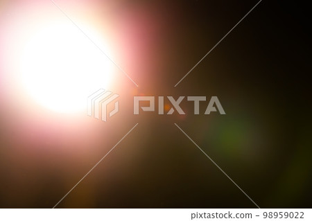 Warm lens flares overlay on black background. Spherical Optical Light leak. 98959022