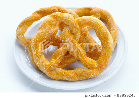 Soft pretzels on a white background. 98959243