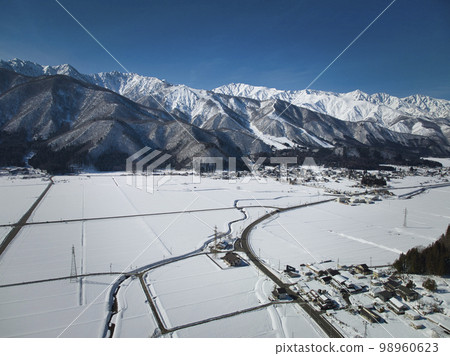 Hakuba mountain range and Goryu ski resort, Hakuba Village, Nagano Prefecture, shining against the beautiful blue sky Hakuba mountain range and Goryu ski resort, Hakuba Village, Nagano Prefecture, shining against the beautiful blue sky 98960623