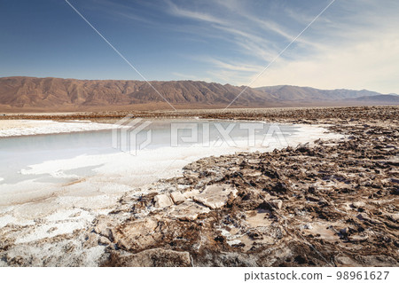 Salt lake, volcanic landscape at sunrise, Atacama, Chile border with Bolivia 98961627