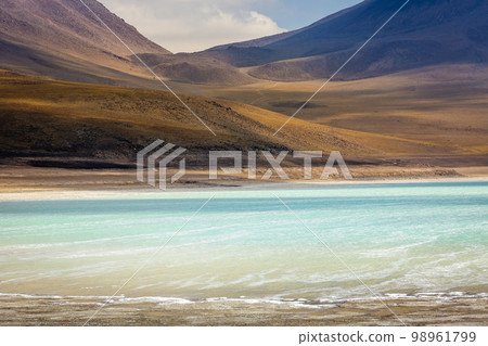 Salt lake, volcanic landscape at Sunset, Atacama, Chile border with Bolivia 98961799