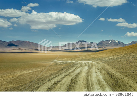 Dirt road in Moon Valley dramatic landscape at Sunset, Atacama Desert, Chile 98961845