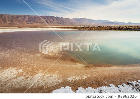Salt lake, volcanic landscape at sunrise, Atacama, Chile border with Bolivia 98962020
