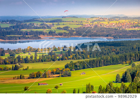 Forggensee Lake in Bavarian alps at golden autumn, Bavaria, Germany Forggensee Lake in Bavarian alps at golden autumn, Bavaria, Germany 98962029