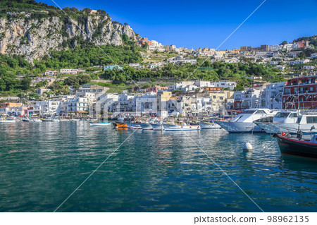 Capri city cliffs and marina with boats and yacht, amalfi coast, Italy Capri city cliffs and marina with boats and yacht, amalfi coast, Italy 98962135