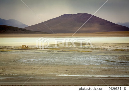 Salt lake, volcanic landscape at Sunset, Atacama, Chile border with Bolivia 98962148