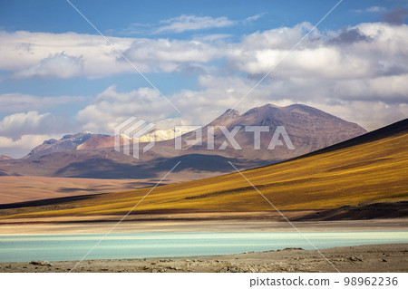 Salt lake, volcanic landscape at Sunset, Atacama, Chile border with Bolivia 98962236