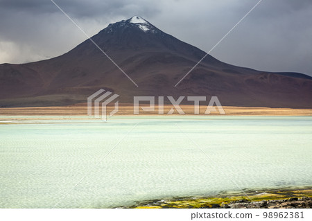 Salt lake, volcanic landscape at Sunset, Atacama, Chile border with Bolivia 98962381