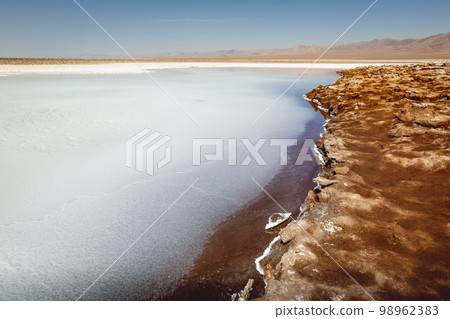 Salt lake, volcanic landscape at sunrise, Atacama, Chile border with Bolivia 98962383